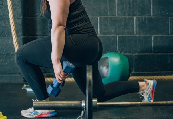 Woman doing squats with weights